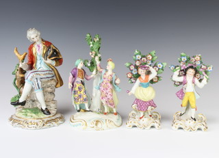 A pair of Samson figures of a lady and gentleman before a tree raised on Rooco bases 16cm, a ditto of a couple before a tree on a Rococo base 19cm and a Continental figure of a seated gentleman beside a tree 20cm 