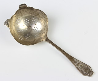 A silver tea strainer Sheffield 1961 and 1 other, 88 grams  