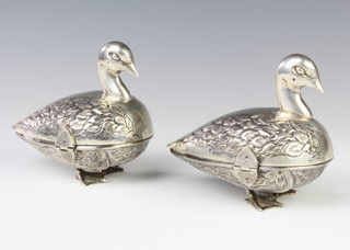 A pair of Egytpian repousse silver boxes in the form of birds with chased feathers 464 grams