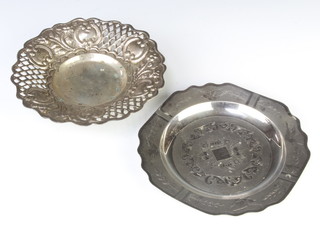 A Continental silver dish with bright cut decoration, birds and flowers 17cm, a repousse silver ditto 17cm, 344 grams 
