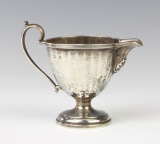 An Art Deco silver cream jug with scroll spout Birmingham 1930 9cm, 94 grams