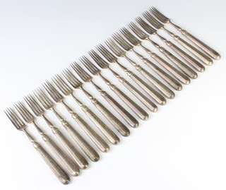 Seventeen Georgian silver forks with reeded handles