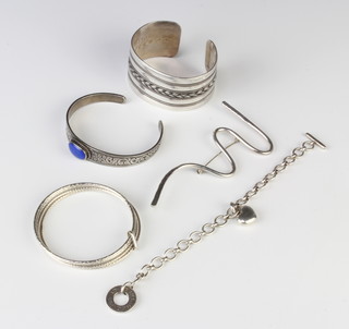 A silver bangle, 2 others, a brooch and a bracelet 147 grams 