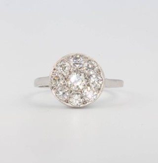 A platinum illusion set cluster diamond ring approx. 1.1ct, size O 