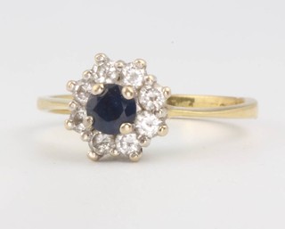 An 18ct yellow gold sapphire and diamond cluster ring size K 2.7 grams