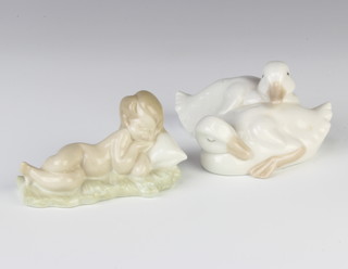 A Lladro figure of a sleeping child 9cm and a Nao group of 2 ducks 