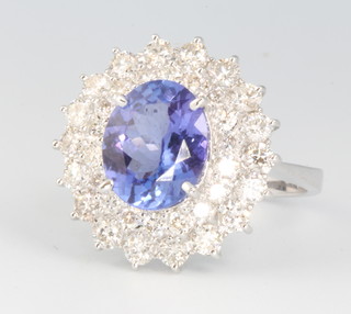 An 18ct white gold oval tanzanite and diamond cluster ring, the centre stone approx. 2.54ct surrounded by brilliant cut diamonds approx. 1.24ct size N 