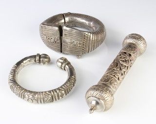 A Middle Eastern silver bangle, 1 other and a pierced holder 