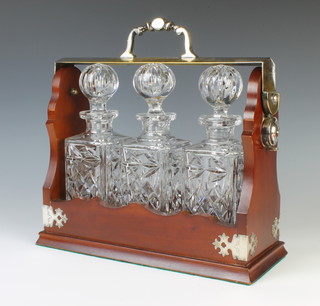 A silver plated mounted 3 bottle tantalus 