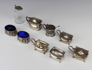 A silver mounted glass oil bottle Birmingham 1927 and 8 other condiments