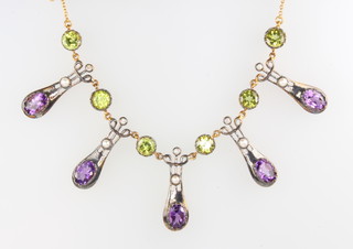 An Edwardian style amethyst, seed pearl and peridot drop necklace on a 9ct yellow gold chain 