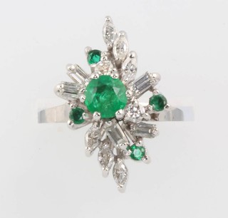 An 18ct white gold emerald and diamond floral ring set with 5 brilliant cut emeralds and baguette and marquise cut diamonds approx. 1ct, size L 