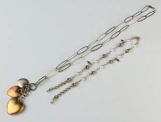 A silver necklace with 3 ditto pendants, another necklace 