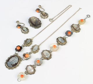 A suite of silver mother of pearl and coral jewellery comprising necklace, brooch, bracelet and earrings 