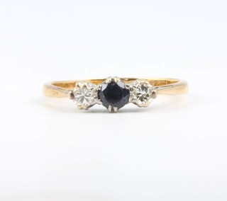 An 18ct yellow gold sapphire and diamond 3 stone ring size O 1/2