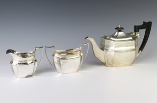 A silver 3 piece tea set, Sheffield 1924 with ebony mounts, maker Walter & Charles Sissons gross weight 1050gr