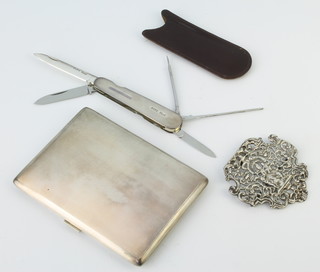 A silver engine turned cigarette case, half of a silver buckle and a silver mounted pen knife Birmingham 1960, weighable silver 190 grams 