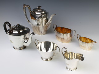 An Edwardian silver plated demi-fluted 3 piece tea set, a ditto with ebony mounts 
