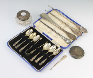 A set of 6 Edwardian silver teaspoons and sugar nips with fancy handles Sheffield 1901, a silver lidded jar, a silver lid and 5 silver handled implements  