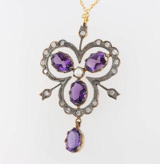 An Edwardian style amethyst and seed pearl and diamond pendant on a 9ct yellow gold chain 