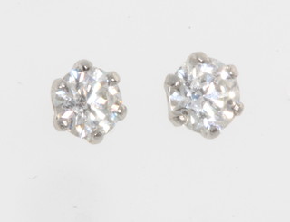A pair of platinum single stone diamond ear studs approx. 0.3ct