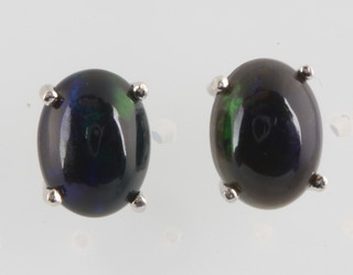 A pair of silver Ethiopian black opal ear studs