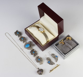 A Continental silver amethyst set locket and chain, a suite of jewellery, bar brooch earrings and watch 