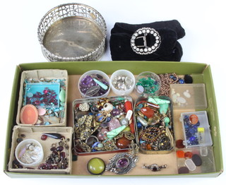 A quantity of loose polished precious and semi-precious stones, minor jewellery and a plated coaster 