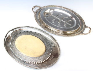 An oval twin plated handled tray 62cm, 1 other, a meat dish and bread board and stand 
