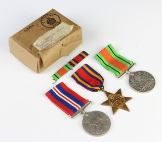 A World War Two group of medals to J W Stewart comprising  Burma Star, Defence and War medal in original posting box 
