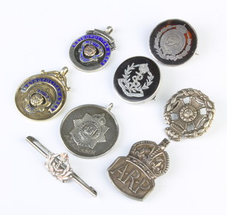 A silver British Legion Metropolitan Area medallion, minor medallions and badges