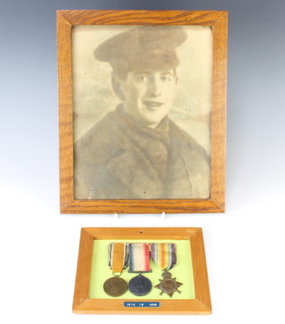 A First World War medal trio to 106277. GNR.W.E. Sayers R.F.A. mounted and framed together with a photograph 