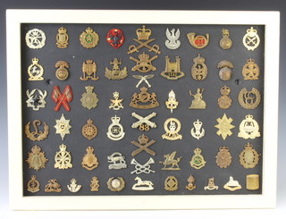 58 World War Two and later cap  badges, 2 others and 2 dog tags 