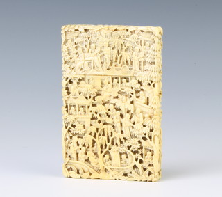 A 19th Century carved Cantonese ivory card case depicting figures before pavilions amongst flowering trees 11cm x 7cm x 1.5cm 