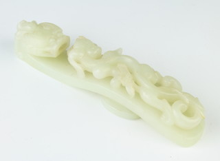 A Chinese carved Celadon jade belt hook in the form of a dragon and it's baby 14cm 