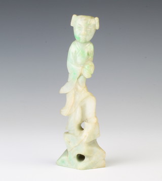 A jade carving of a standing figure with apple green flecks 15cm 