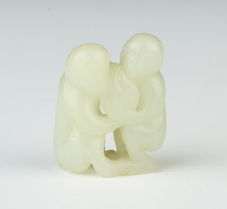 A carved jade figure of 2 monkeys holding a fruit 3.5cm 