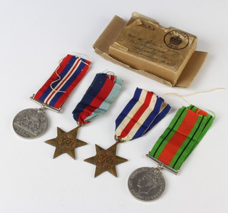 A World War Two group of medals to W Glendenning 1939-45 France Germany Defence and War medal, in original posting box 