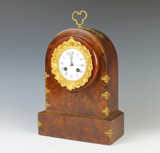 A Victorian French striking mantel clock with enamelled dial and gilt metal bell, contained in an arched walnut and gilt metal mounted case 