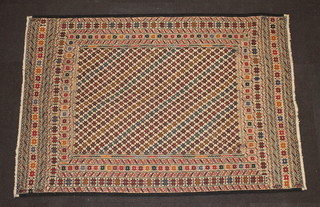 A white, brown and black ground Shumack Kilim rug with multirow border 135cm x 97cm 
