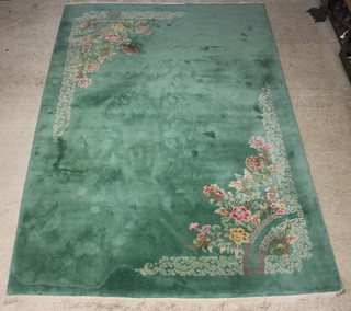 A 1930's green and floral patterned Chinese carpet 187cm x 122cm 