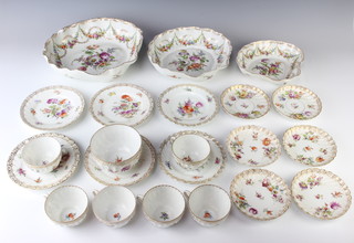 A 20th Century Dresden service comprising 3 scalloped dishes, 6 tea cups, 6 saucers, 6 plates and a sugar bowl decorated with flowers and swags 
