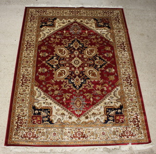 A brown and white ground Belgium cotton Persian style Heriz carpet with central medallion 280cm x 200cm 
 
