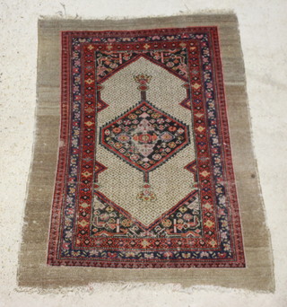 A brown and blue ground Serapi rug with central medallion within multi row border, in wear and reduced in length 145cm x 105cm 