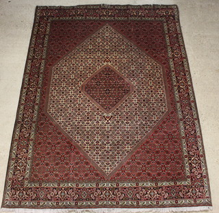 A red and blue ground Persian Bidjar carpet 340cm x 253cm 