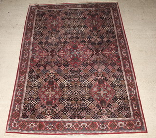 A red and blue ground floral patterned Jashaqan carpet 380cm x 270cm 