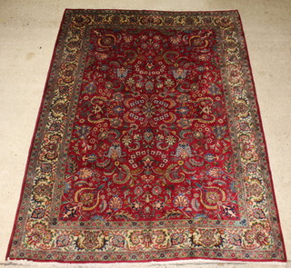 A red and blue ground floral patterned Tabriz carpet within multi row borders 326cm x 247cm  
