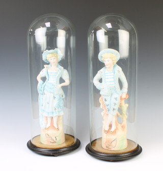 A pair of Continental bisque figures of a lady and gentleman raised on rocky bases 33cm contained within 2 Victorian glass domes with wooden bases 