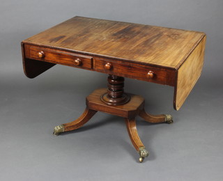 A Georgian mahogany pedestal sofa table fitted 2 long drawers with ebony stringings, raised on a turned column and triform base on paw feet 71cm h x 101cm w x 71cm d