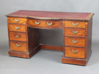 An Edwardian inlaid mahogany bow front dressing table with inset writing surface above 1 long and 8 short drawers with brass swan neck drop handles 81cm h x 148cm w x 61cm d  